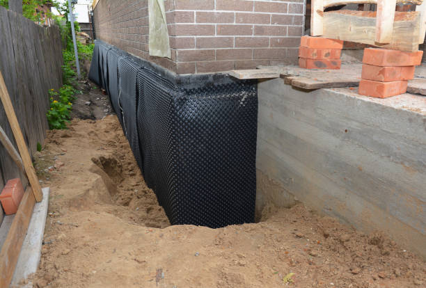 Happy homeowners after waterproofing job in Plain City